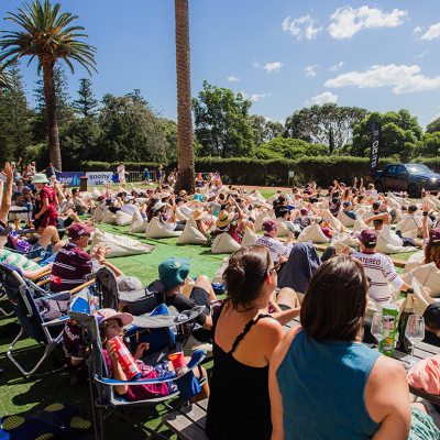 a group of people sitting at a park
